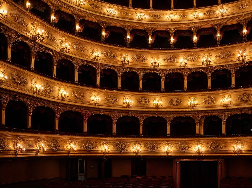 Tiers of gilded rococo theatre boxes in red and gold
